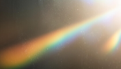 Blur colorful warm rainbow light leaks on black background with dust texture. Defocused abstract damaged scratched retro film analog effect for using over photos as overlay or screen filter