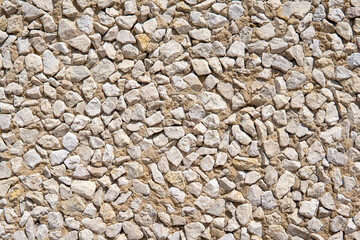Stone wall texture. Beige stone wall background