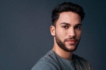 Studio, business man and portrait with pride, creative and employee with ideas for journalism. Professional, career and male journalist with confidence, article goals and mockup by gray background
