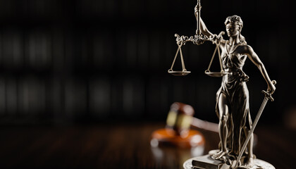Legal Concept: Themis is the goddess of justice and the judge's gavel hammer as a symbol of law and order on the background of books