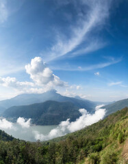 Beautiful panoramic view of mountain and meadow with blue sky