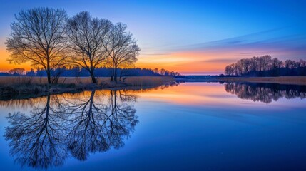 Fototapeta premium Sunset Reflections on Tranquil Lake