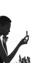 Attractive woman playing chess and holding the queen © stokkete