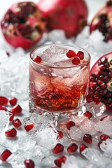 Crystal glasses filled with sparkling pomegranate cocktails and ice