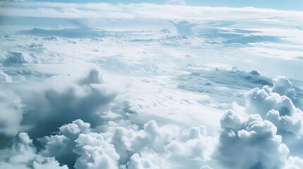 Serene Skyline: Aerial View of Fluffy White Clouds and Blue Skies