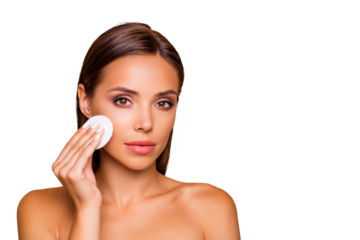 Portrait of beautiful lovely pretty  well-groomed charming lady with her naked shoulders she isolated on pastel beige background with copy space for text use micellar water and circle white pad