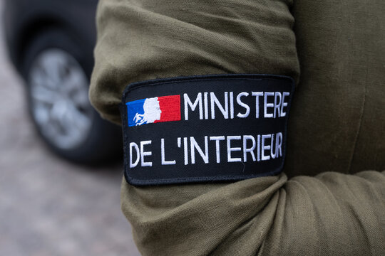 A plainclothes policeman's armband with the words: Ministere de l'Interieur  and logo 