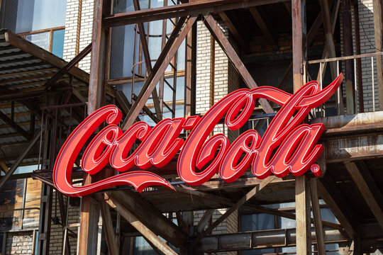 Belarus, Minsk - 05 may 2024: There is a big red coca cola sign positioned on a building