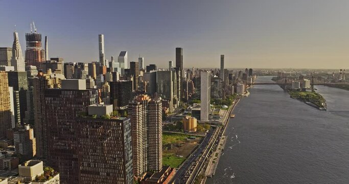 NYC New York Aerial v399 flyover East river capturing Freedom Plaza in Murray Hill and Midtown East Manhattan cityscape, sunlight glowing on the buildings - Shot with Mavic 3 Pro Cine - September 2023