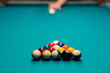 Billiard player at billiard table or snooker billiards pool sport game