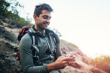 Phone, smile and hiking man in forest with backpack for fitness, training and location, search or...