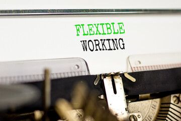 Flexible working symbol. Concept words Flexible working typed on beautiful old retro typewriter. Beautiful white paper background. Business flexible working concept. Copy space.