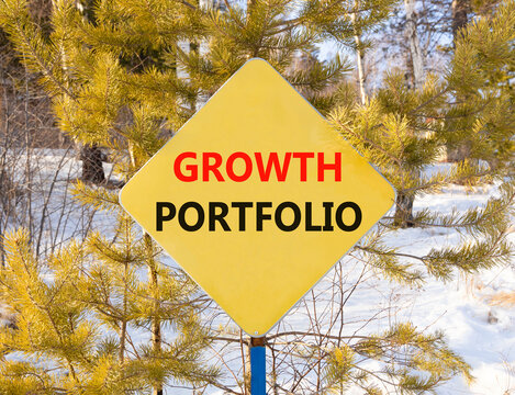 Growth portfolio symbol. Concept words Growth portfolio on beautiful yellow road sign. Beautiful forest trees snow background. Business Growth portfolio concept. Copy space.