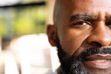 Outdoors, African American senior man, maintaining well-groomed beard, copy space