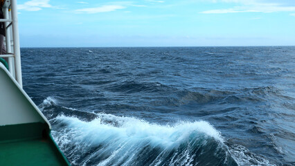 Waves from floating sea vessel. Clip. Beautiful moving waves from floating ship at sea. Beautiful...