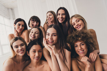 Obraz premium Portrait of group sweet ladies in beige lingerie posing to seduce their boyfriends isolated on white color background