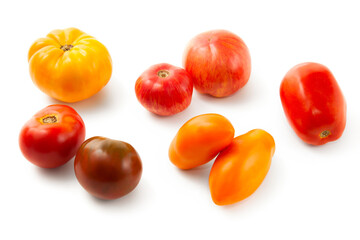Assort of different shape and color tomatoes isolated on white background with clipping path. .