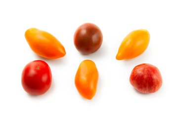 Assort of different shape and color tomatoes isolated on white background with clipping path. .