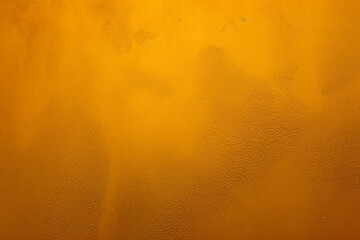 Gold Decorative Plaster. Venetian Stucco texture. Golden Venetian Plaster Background. Abstract Gold grunge background for design