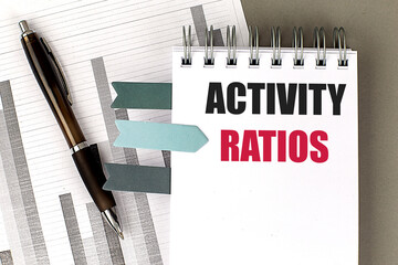 ACTIVITY RATIOS text on notebook with chart on gray background