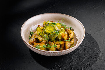 Gourmet roasted vegetable dish on dark background