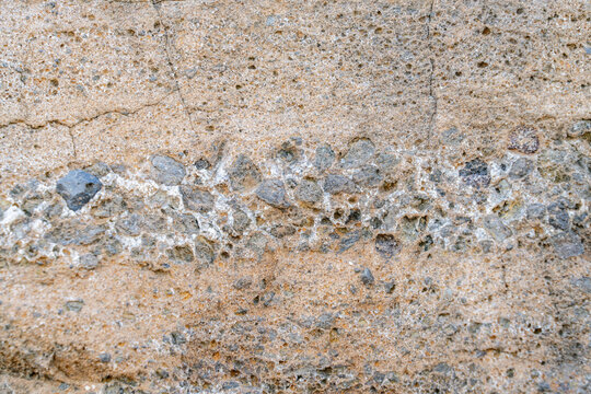 Caliche with Tuff, Tuff is a type of rock made of volcanic ash ejected from a vent during a volcanic eruption.  Oahu Hawaii geology. Diamond Head Crater, Honolulu Volcanics, calcium carbonate;