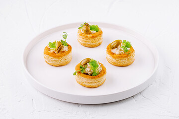 Gourmet vol-au-vents on elegant white plate