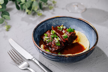 Succulent braised beef ribs with creamy polenta