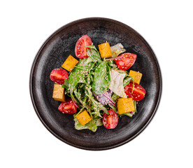 Fresh garden salad on a black plate
