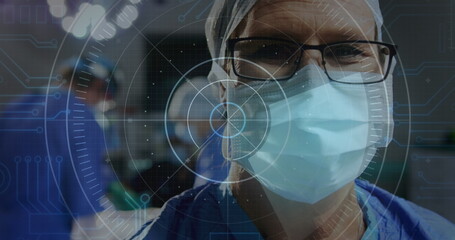 Image of round scanner against caucasian senior male surgeon at hospital