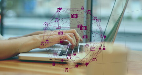 Image of globe of digital icons spinning over mid section of a woman using a laptop at a cafe