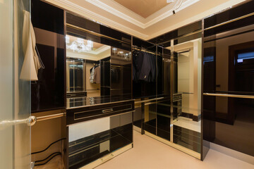 Wide wooden dressing room, Interior of a modern house. Image for ideas and design