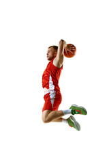 Athlete in red basketball jersey and shorts, leaping in motion high for powerful dunk against white studio background. Concept of professional sport, games, healthy lifestyle, tournament, action. Ad © Lustre Art Group 