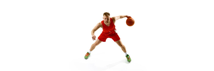 Banner. Focused on game, basketball athlete training dribbling technique against white studio background with copy space. Concept of professional sport, games, healthy lifestyle, tournament, action.