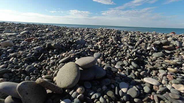 tower of flat stones fall over on rocky beach in Batumi Georgia