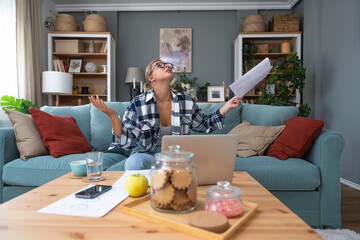 Young business woman shouting trying to not to hear the loud noise from neighbor apartment in building while they renovate home and cant work on laptop or study for school exam because of the noise