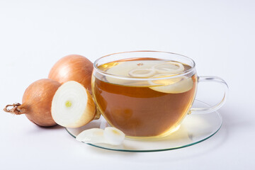 healthy onion tea in transparent tea cup on white background