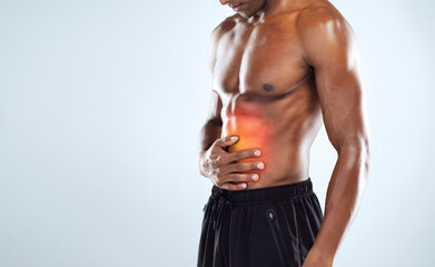 Man, stomach and muscle injury in studio for workout, training and gut health by white background....
