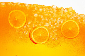 Textured photo. Festive arrangement of citrus fruit, orange slices crowns celebratory drink. Abstract wallpaper. Concept of food and drinks, summer, vitamins, nutrition, dieting.
