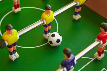 Ball and figures on the foosball table, Close-up view