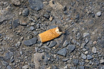 Cigarette butt thrown on the floor.
