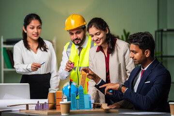 Indian asian Architect, builder and engineer in a team meeting discussing construction projects