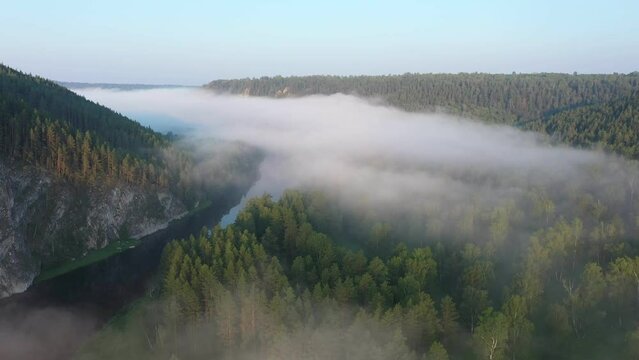Scenic aerial view of river with morning haze. Belaya river (Agidel)