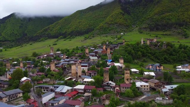Aerial video of ancient Georgian towers. Soar above the clouds and experience the grandeur of these ancient sentinels. Ideal for creating a sense of awe and wonder in your film projects.