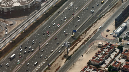 Aerial view of busy highway with traffic in the rush hour. Action. Multi lane road with many cars...