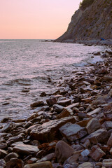 Sunset on the stony sea beach