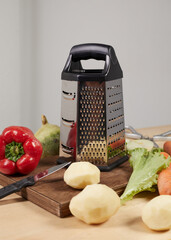 various vegetables around the grater