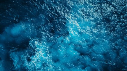 Obraz premium Top down view of a deep blue ocean shoreline,aerial photography, generated with AI