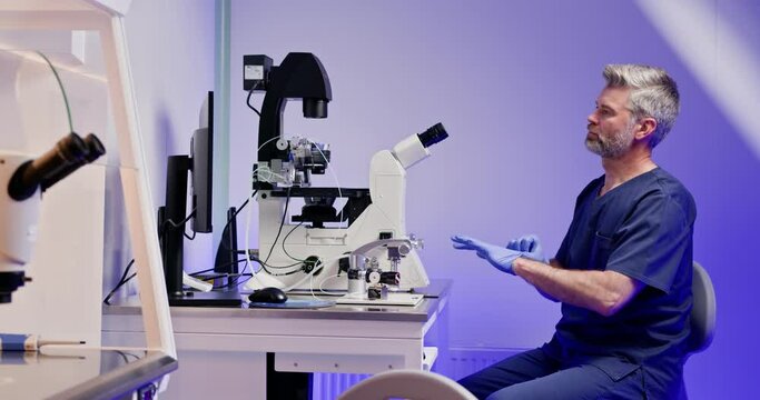 Embryologist performing artificial fertilization of an egg in a laboratory, using advanced microscope technology. IVF process in a modern lab setting. Artificial Fertilization in Laboratory Setting.