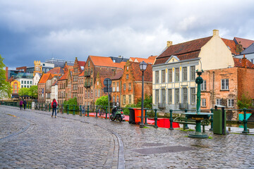 Scenic view of the historical city center of Ghent (Gent), Belgium. Beautiful cityscape with medieval architecture, monumental landmarks and Lys river with tourist boats, outdoor travel background